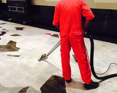 A Big Red specialist cleaning a hotel ballroom carpet