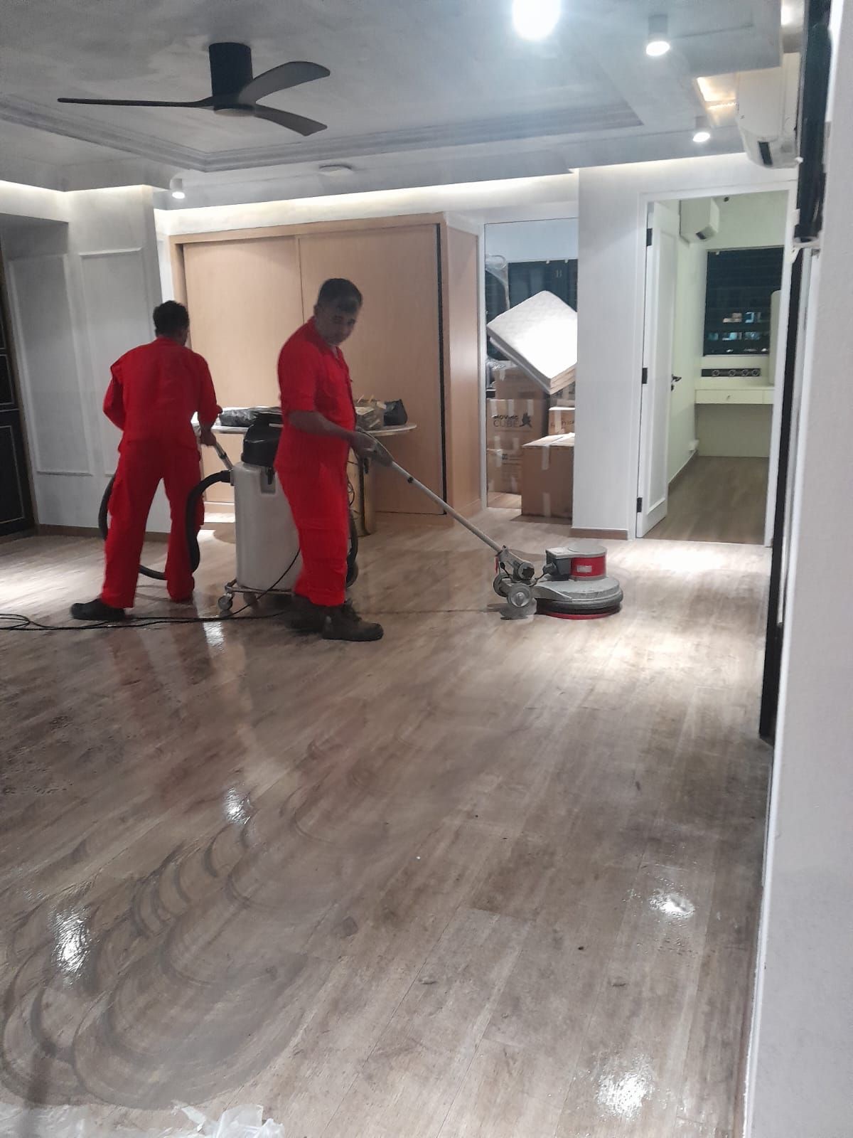Buffing and polishing a timber floor in a Singapore home
