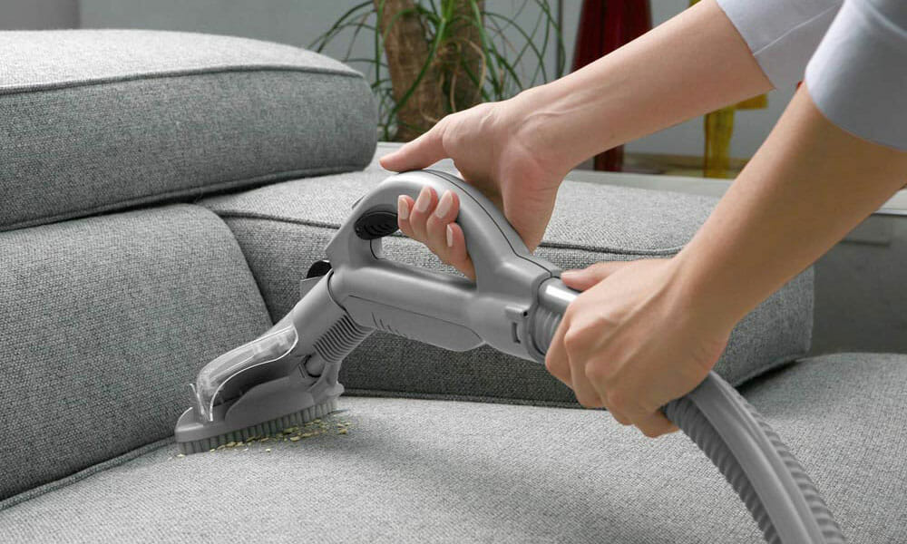 Hot water extraction cleaning of a fabric sofa in a Singapore home