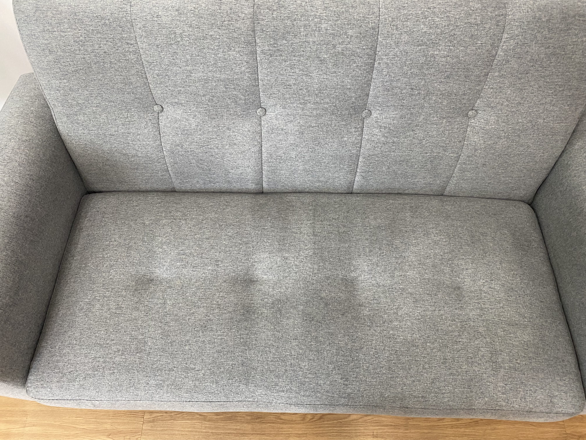Clean light grey fabric sofa in a bright Singapore living room