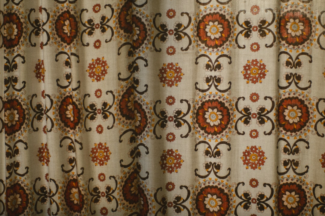 Cream fabric with brown and orange floral pattern
